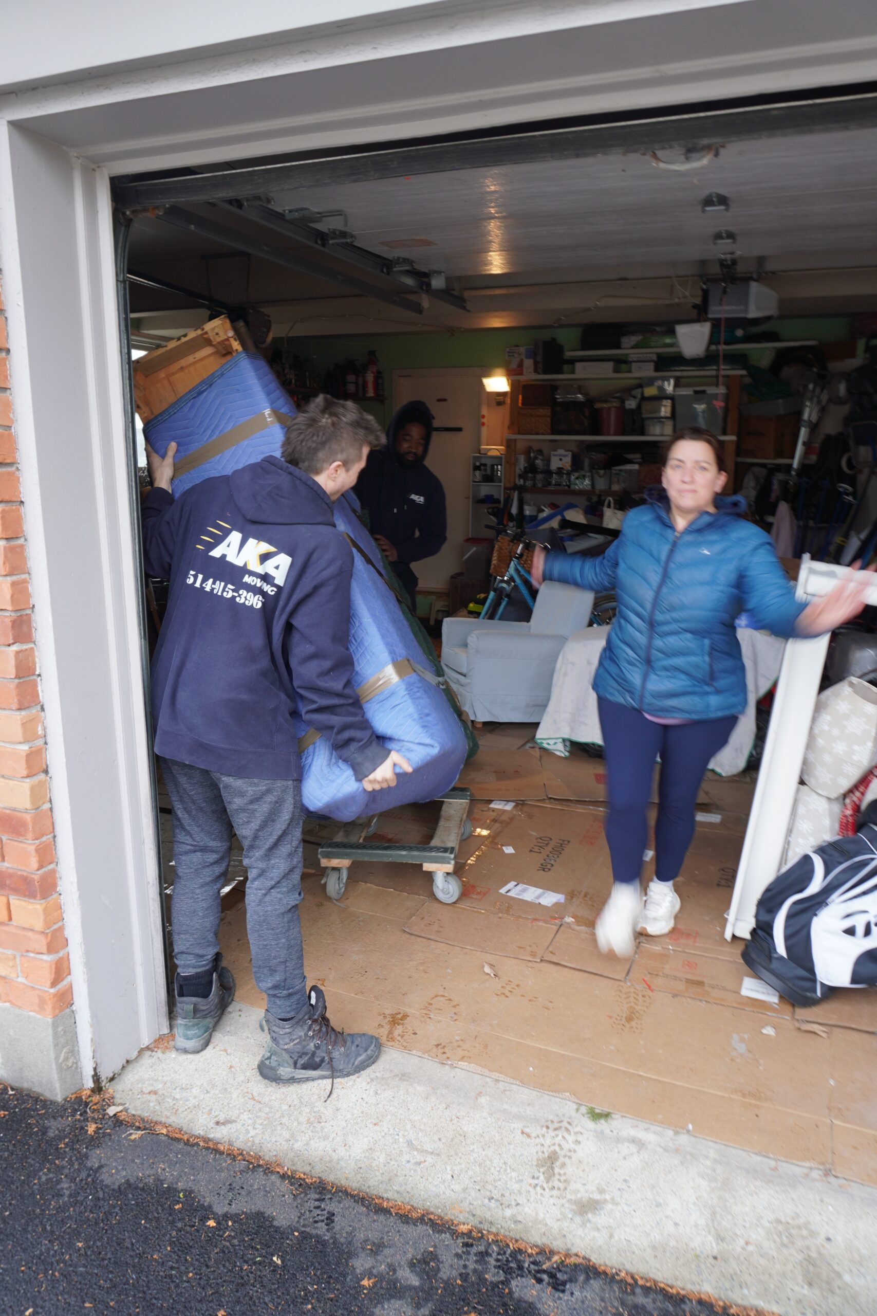 AKA Moving crew carrying a custom crate during a long-distance move